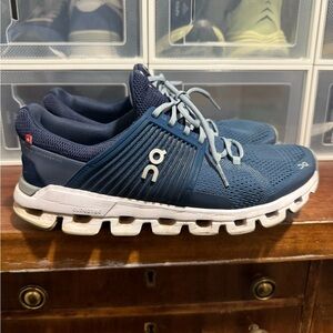 On Running Blue and White Athletic Shoes with Cloud Cushioning